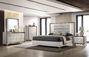Modern bedroom set with bed, dresser, and nightstands in a well-lit room.